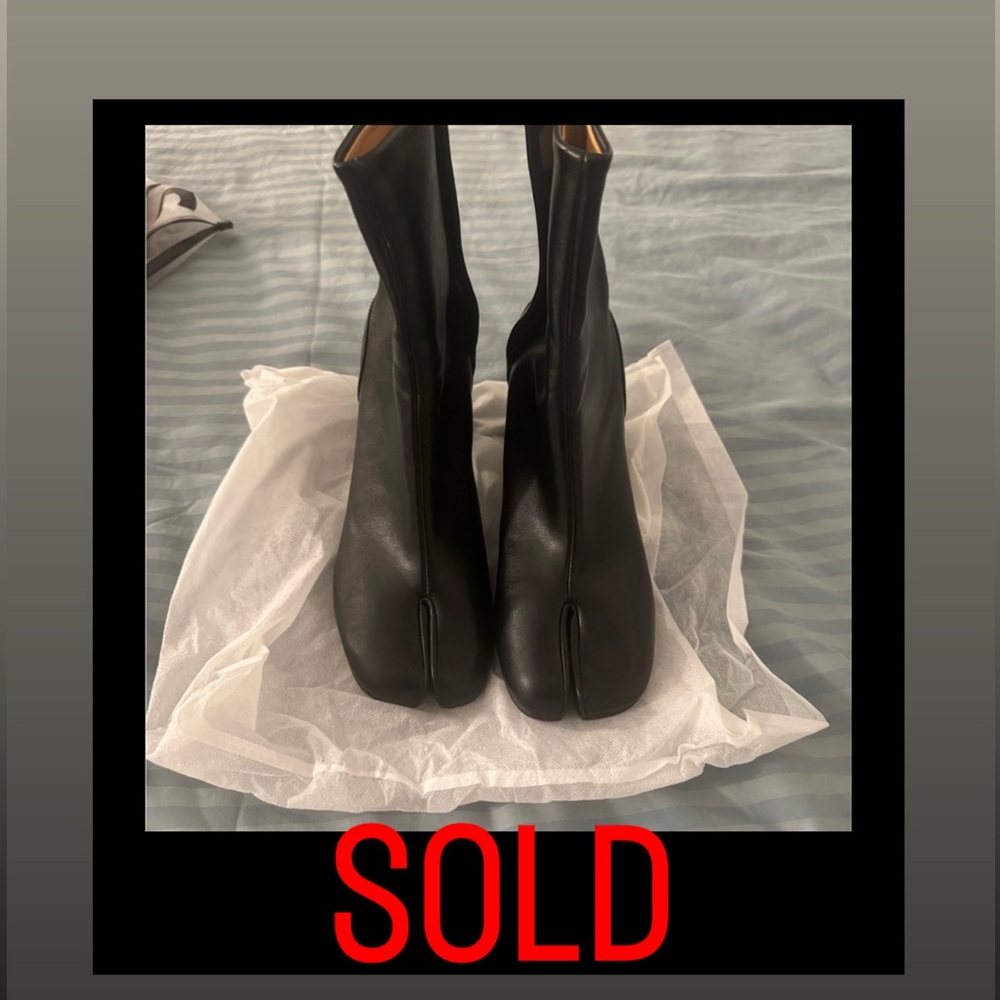 Sleek Black Ankle Toe Boots with Modern Design